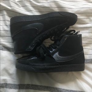 Black Nike hightop shoes